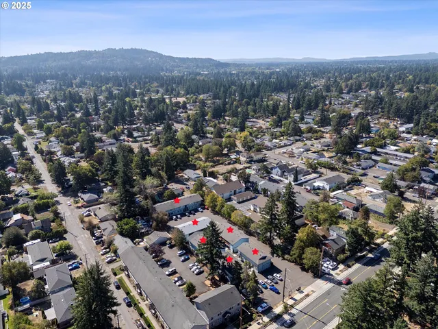 an aerial view of a town with couple of houses