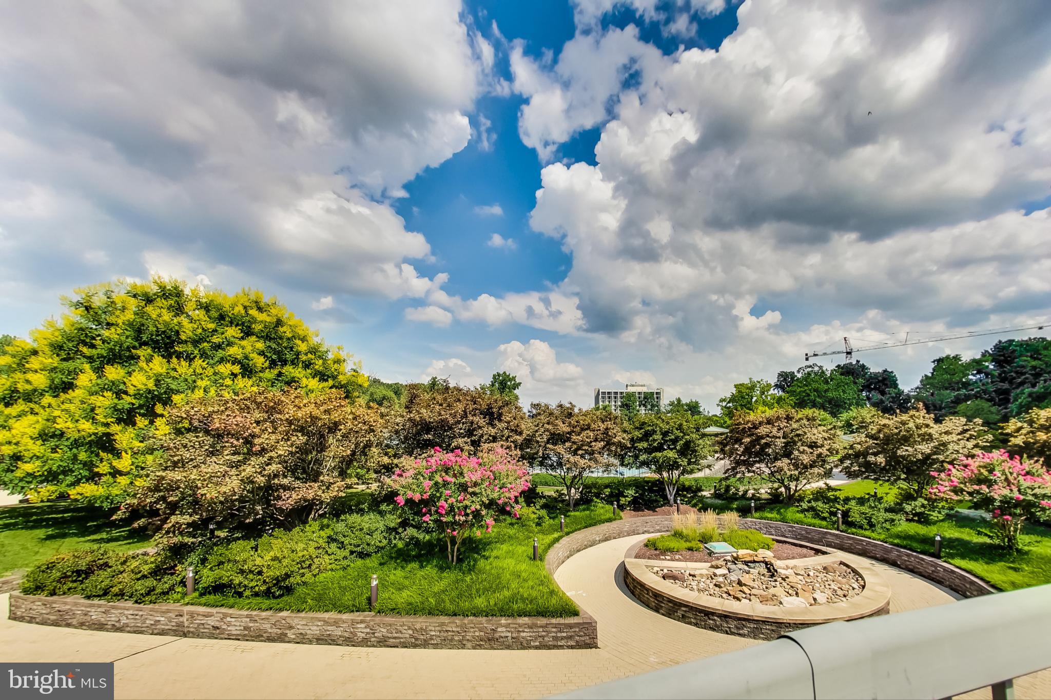 5225 Pooks Hill Road, Unit 1128S Bethesda, MD 20814 - Photo 15 of 61 a view of a swimming pool with a yard in back