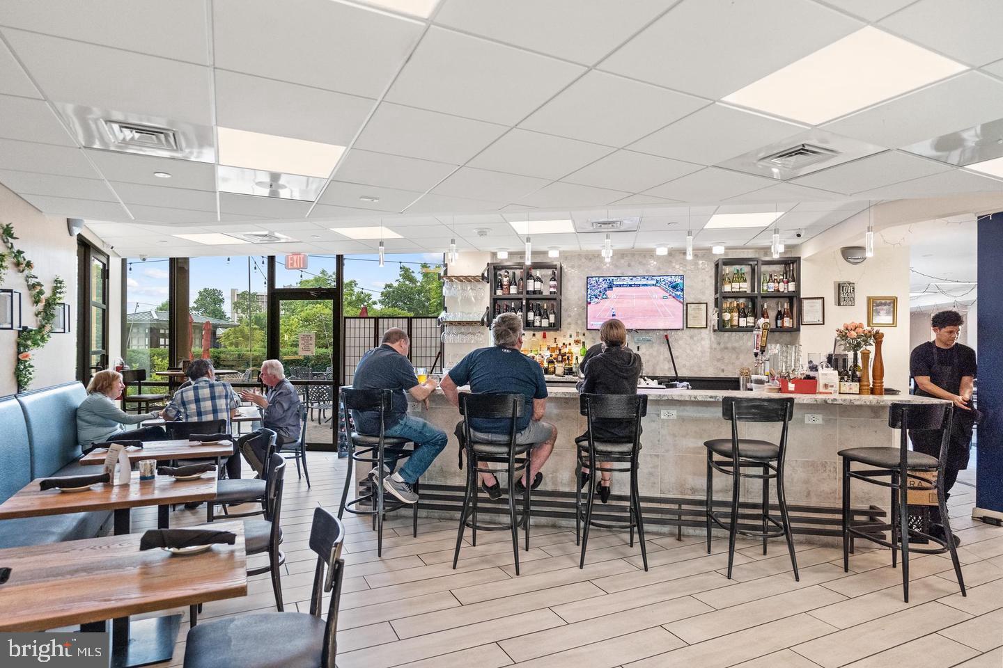 5225 Pooks Hill Road, Unit 1128S Bethesda, MD 20814 - Photo 36 of 61 a group of people sitting on floor