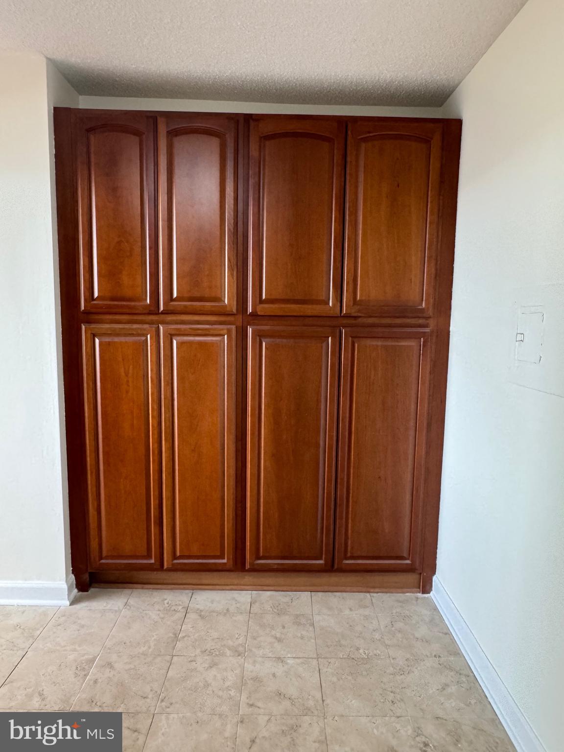 5225 Pooks Hill Road, Unit 1128S Bethesda, MD 20814 - Photo 59 of 61 an empty room with wooden floor