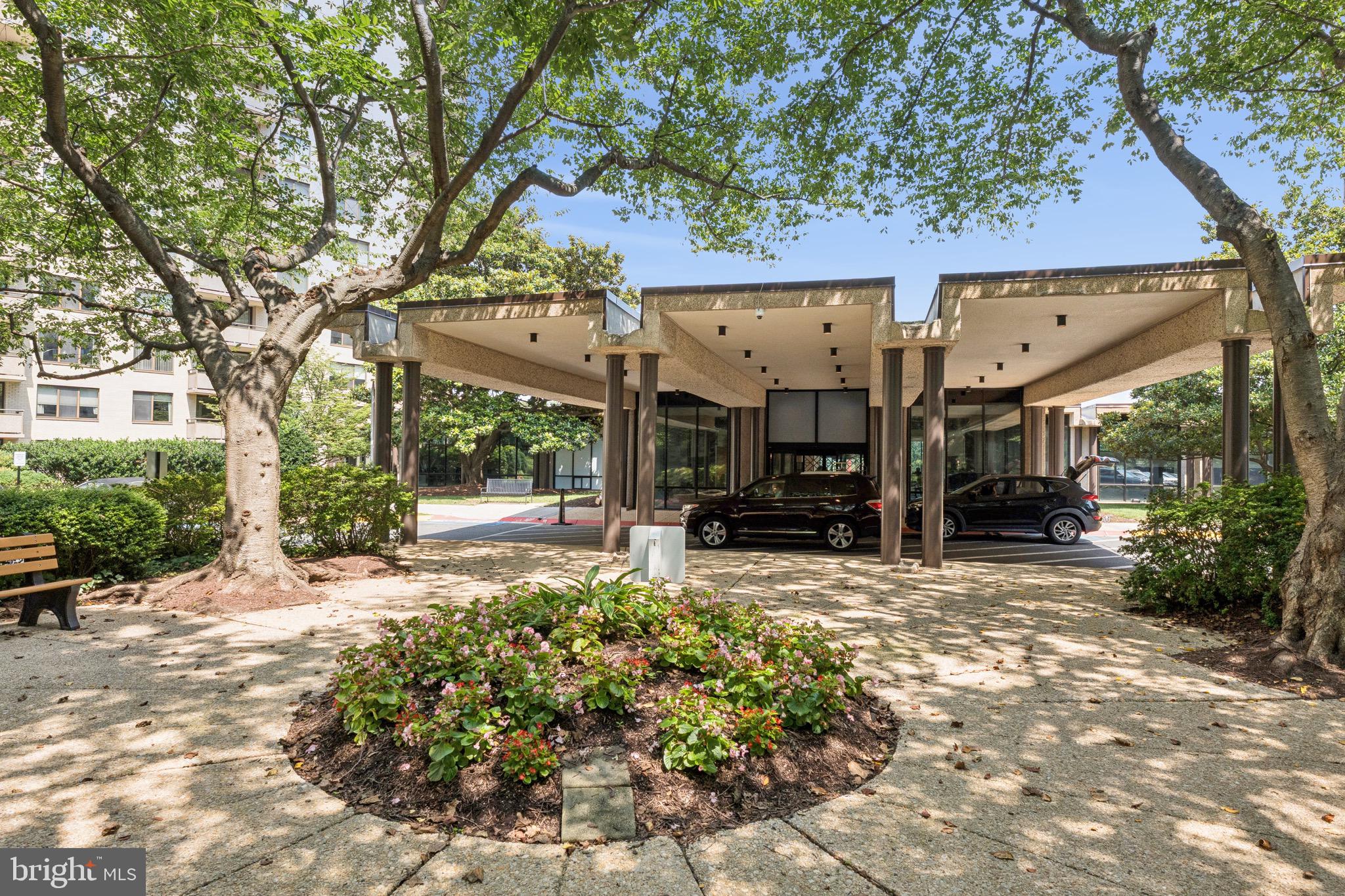 5225 Pooks Hill Road, Unit 1128S Bethesda, MD 20814 - Photo 6 of 61 a view of a house with a tree in the background