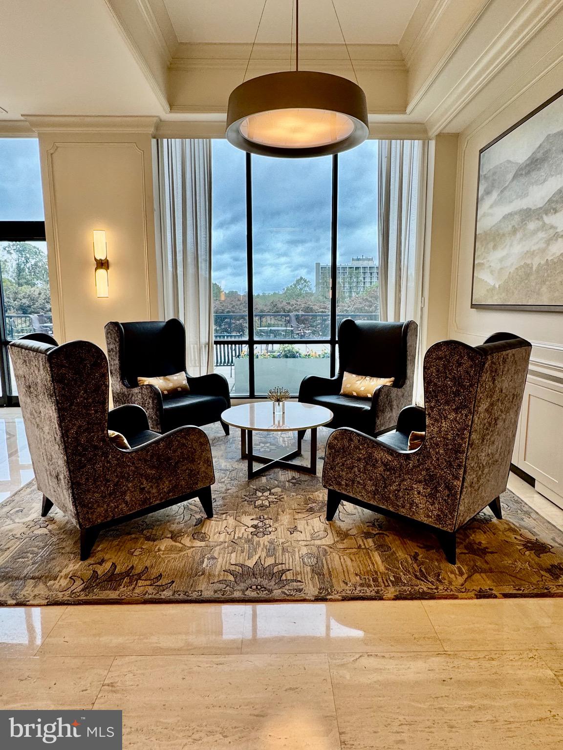 5225 Pooks Hill Road, Unit 1128S Bethesda, MD 20814 - Photo 10 of 61 a living room with furniture and large windows