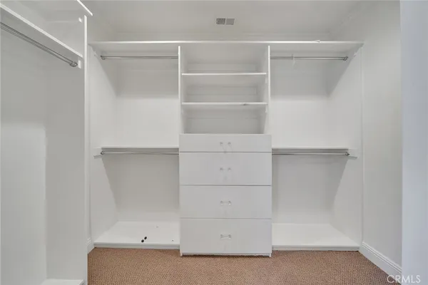 a view of an empty walk in closet
