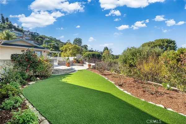 a view of a big yard with a house