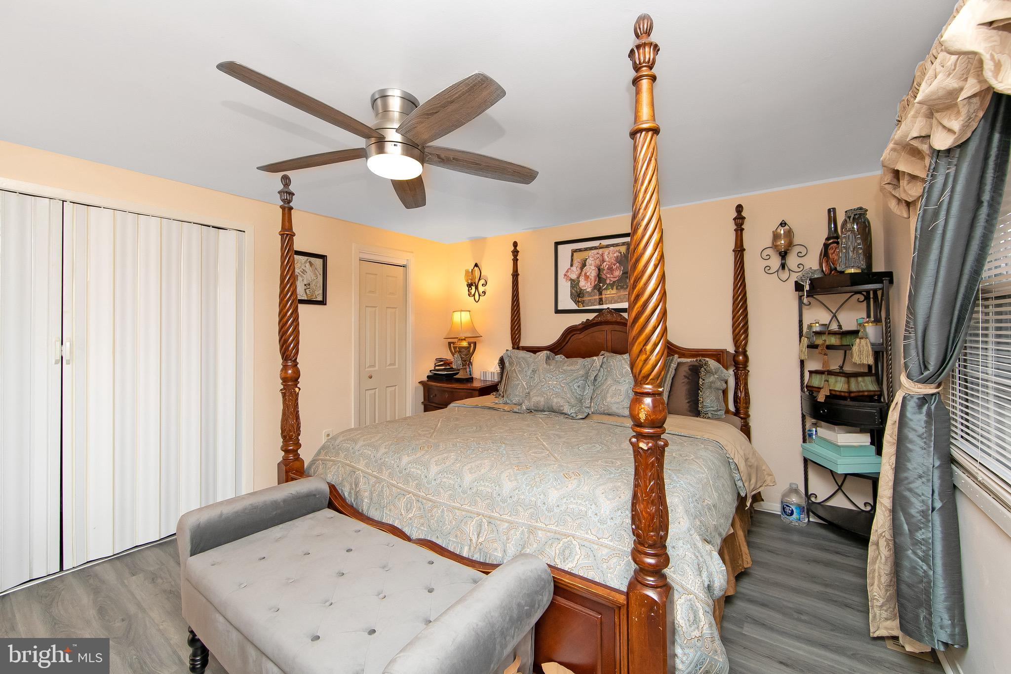 40 Rittenhouse Drive Willingboro, NJ 08046 - Photo 15 of 32 a bedroom with a bed and a chandelier