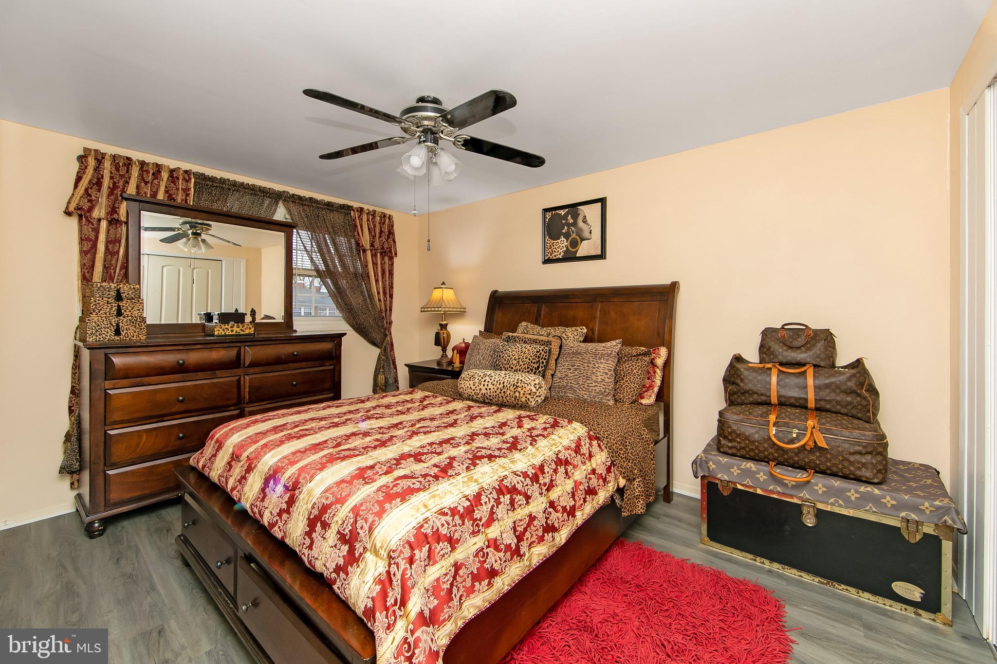 40 Rittenhouse Drive Willingboro, NJ 08046 - Photo 17 of 32 a bedroom with a bed and dresser with wooden floor