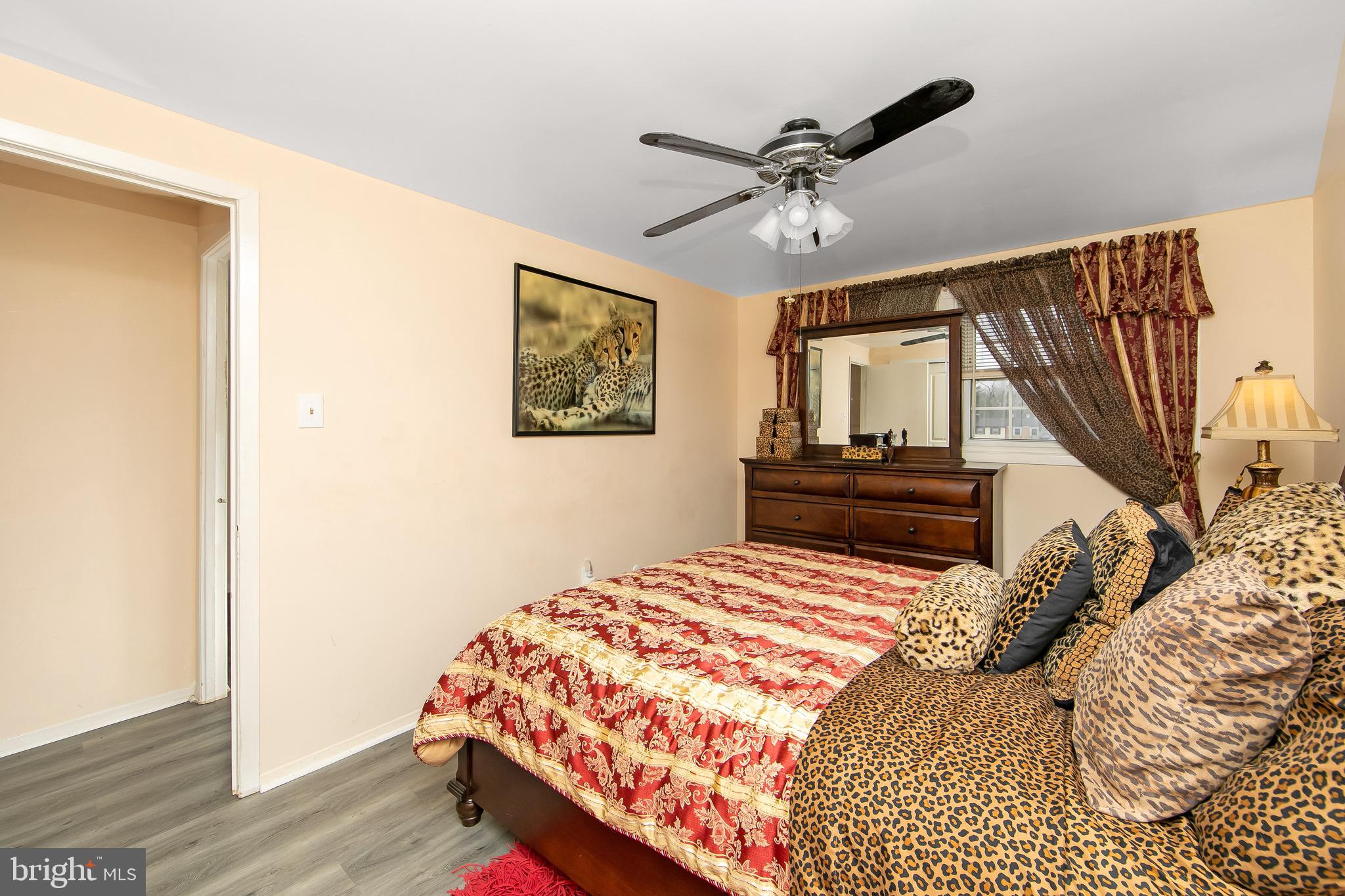 40 Rittenhouse Drive Willingboro, NJ 08046 - Photo 19 of 32 a bedroom with a bed and a chandelier