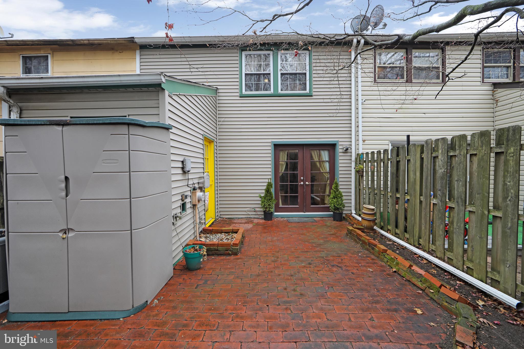 40 Rittenhouse Drive Willingboro, NJ 08046 - Photo 25 of 32 a view of a house with a small yard and wooden fence