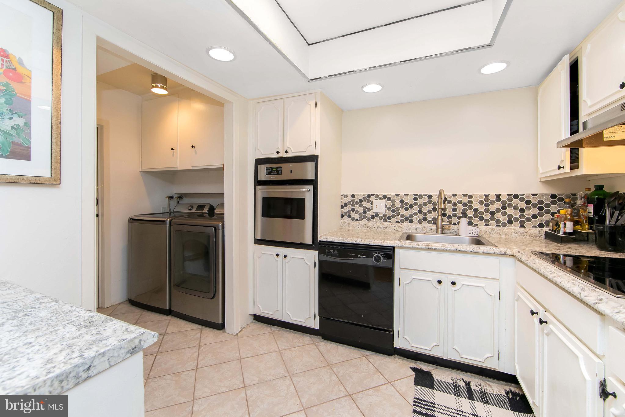 40 Rittenhouse Drive Willingboro, NJ 08046 - Photo 9 of 32 a kitchen with granite countertop a sink stove and refrigerator
