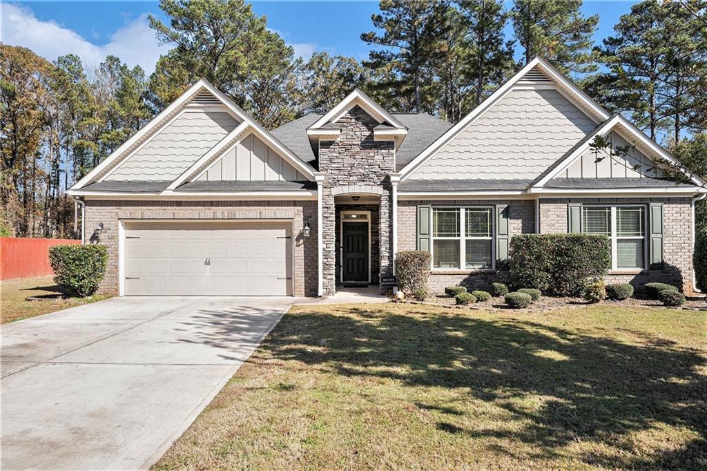 70 Cowan Ridge Covington, GA 30016 - Photo 1 of 1 a front view of a house with a yard