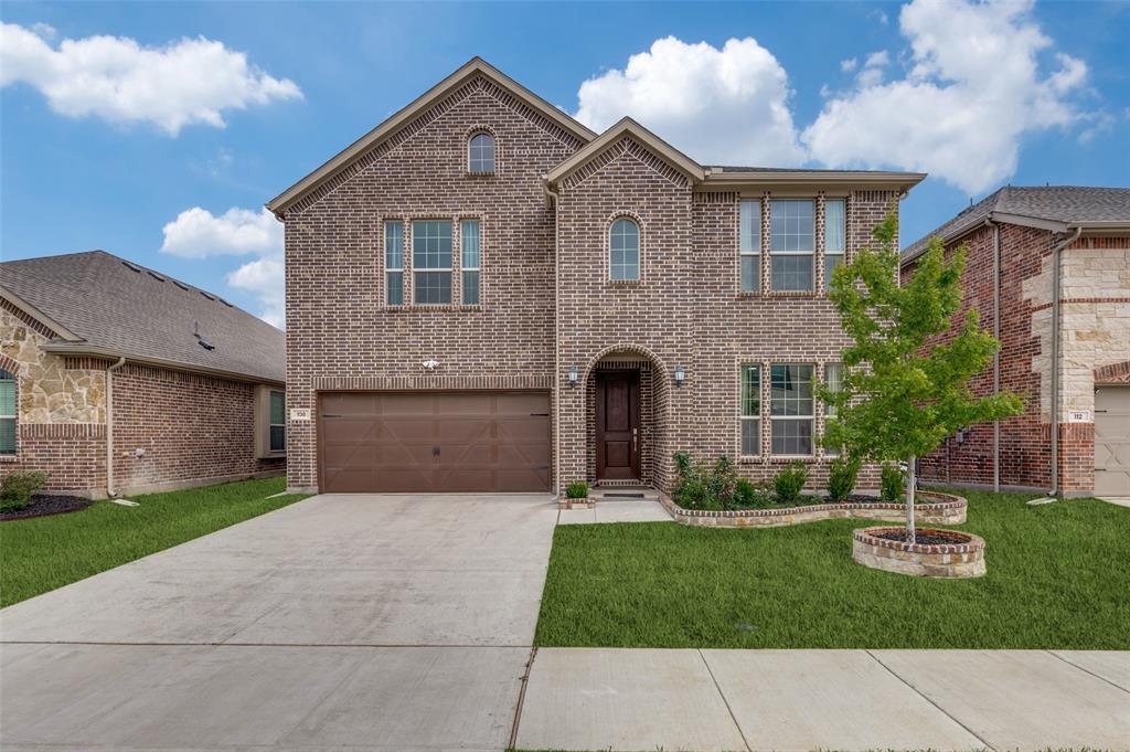 108 Invermore Drive Little Elm, TX 75068 - Photo 1 of 19 a front view of a house with a yard and garage