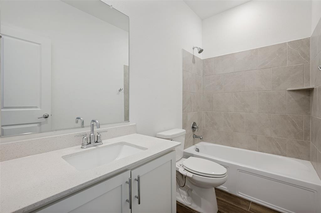 108 Invermore Drive Little Elm, TX 75068 - Photo 17 of 19 a bathroom with a sink a toilet and a bathtub