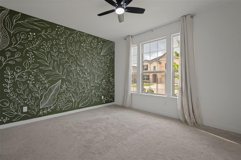 108 Invermore Drive Little Elm, TX 75068 - Photo 3 of 19 a view of a livingroom with a ceiling fan and window