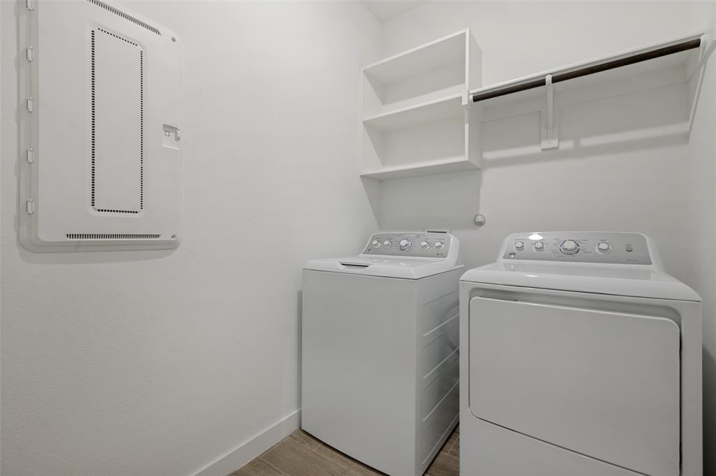 108 Invermore Drive Little Elm, TX 75068 - Photo 6 of 19 a utility room with dryer and washer