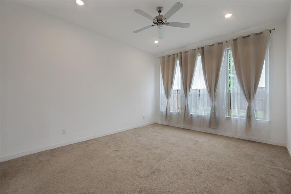108 Invermore Drive Little Elm, TX 75068 - Photo 7 of 19 an empty room with windows and outdoor view