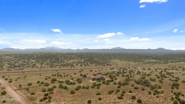 a refrigerator and a wooden shelf