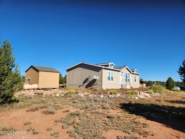 a view of a chairs and table in a patio