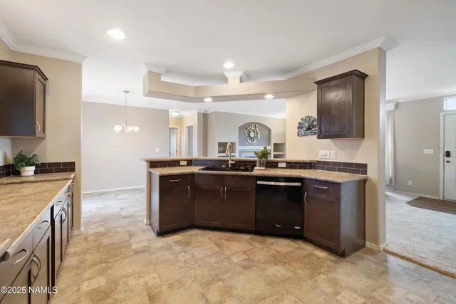a kitchen with stainless steel appliances granite countertop a stove and a sink