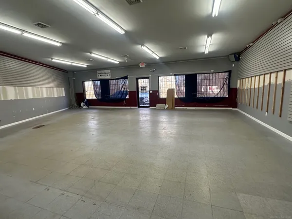 a view of an empty room with windows