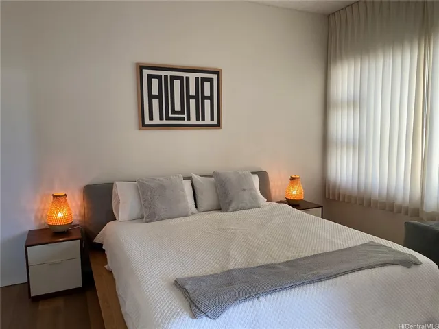 a bedroom with a bed and window