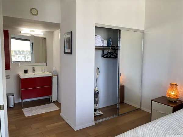 a view of kitchen with stainless steel appliances granite countertop a refrigerator and a sink