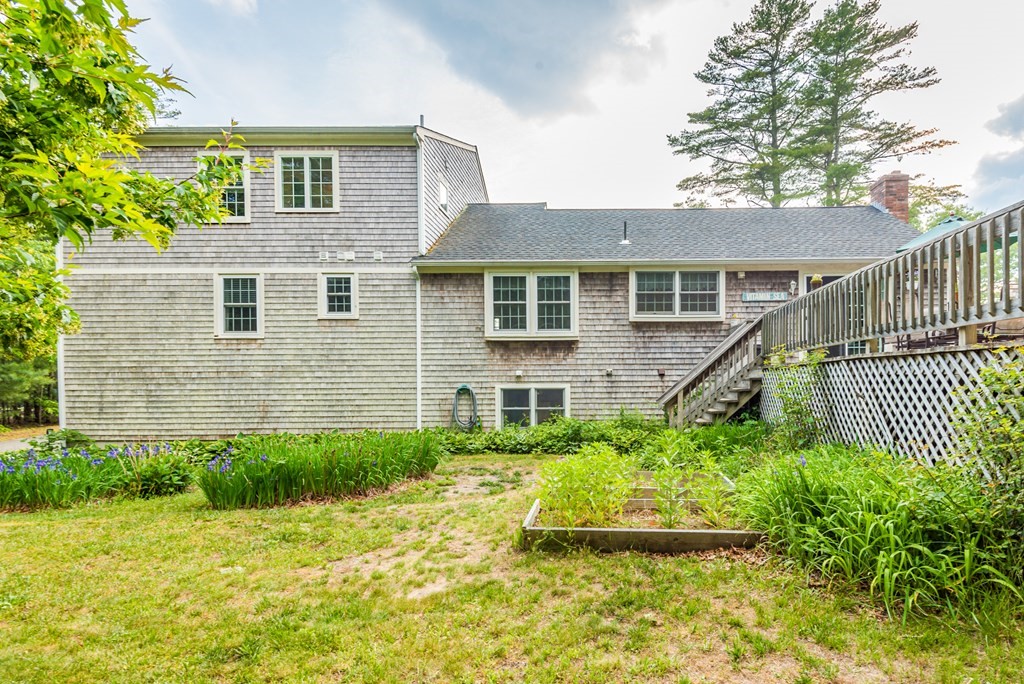 324 Nye Road Barnstable, MA 02632 - Photo 30 of 37 a front view of a house with a yard