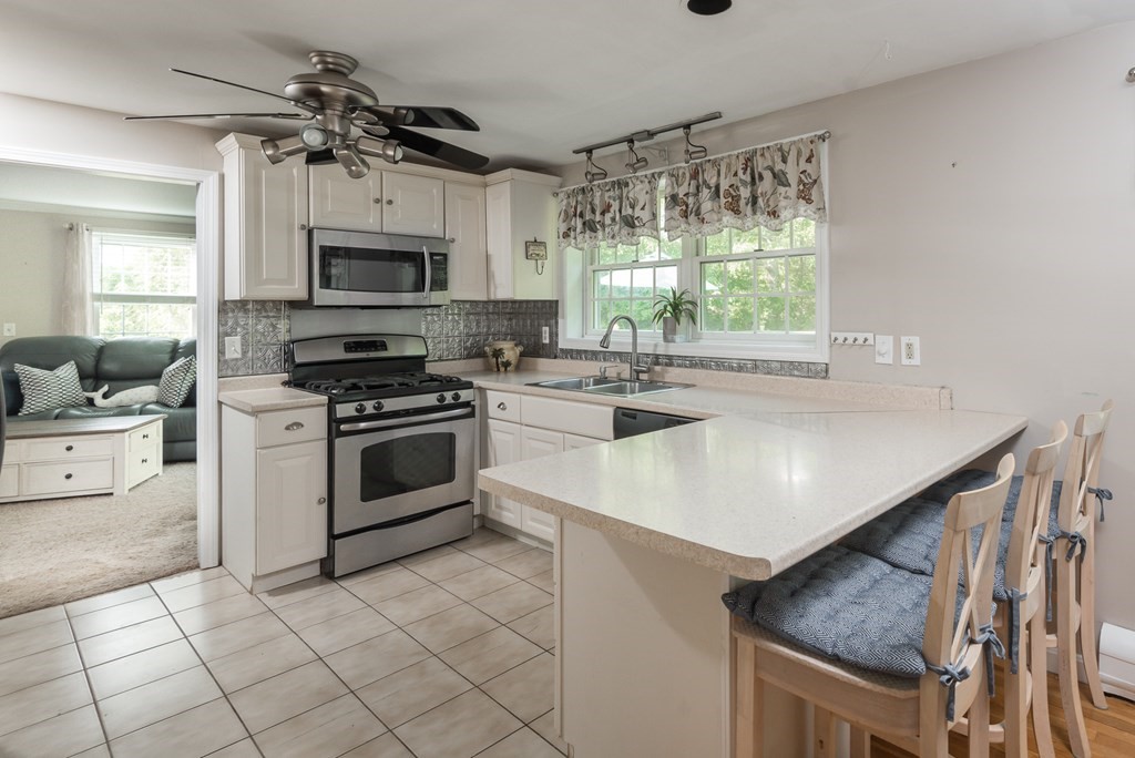 324 Nye Road Barnstable, MA 02632 - Photo 3 of 37 a kitchen with a stove a sink and a refrigerator