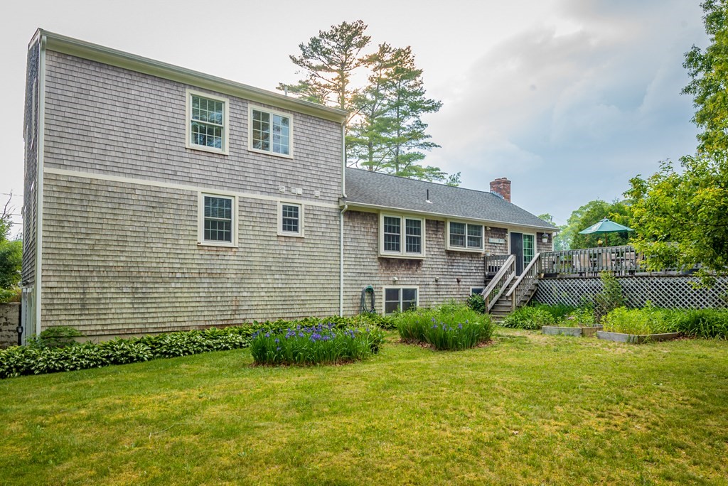 324 Nye Road Barnstable, MA 02632 - Photo 31 of 37 a front view of a house with a garden