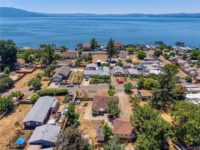 an aerial view of a house with a yard