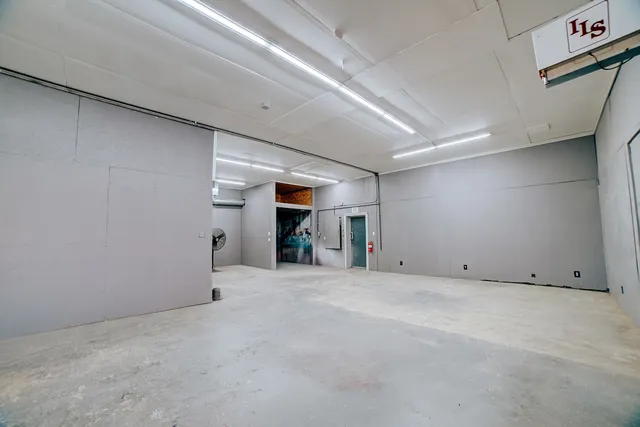 a view of a hallway with stairs