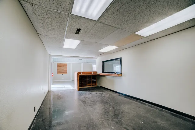 a bathroom with a glass shower door