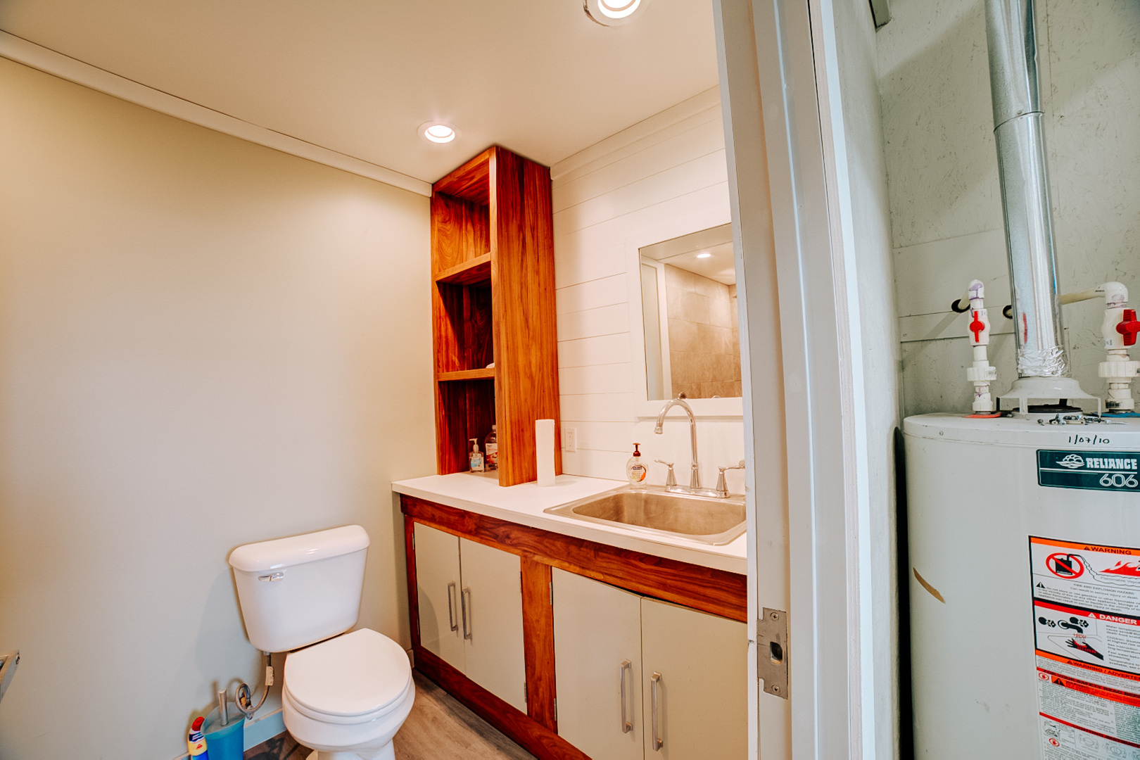 304 West Walnut Street Watseka, IL 60970 - Photo 27 of 28 a bathroom with a toilet sink and mirror