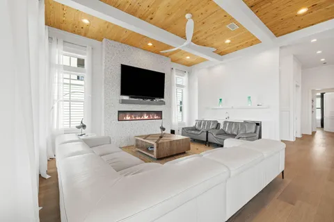 a spacious bedroom with a large bed and a large window