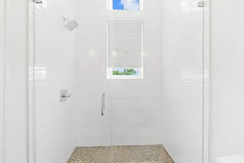 a white bath tub sitting in a bathroom