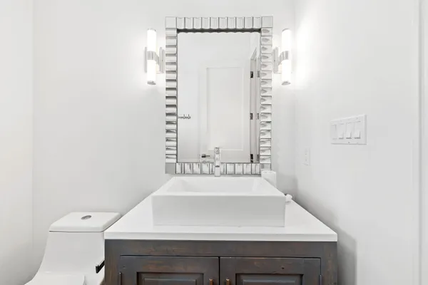 a bathroom with a sink and a mirror
