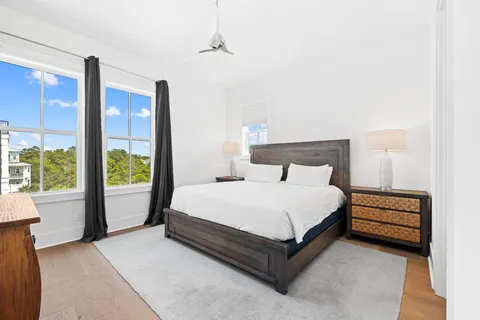 a bedroom with a large bed and a large window