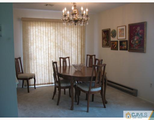 625 B Deal Road Monroe Township, NJ 08831 - Photo 3 of 10 a view of a dining room with furniture window and outside view