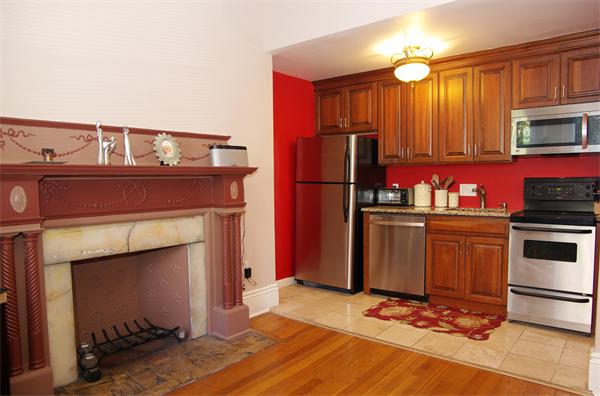 479 Beacon Street, Unit 11 Boston, MA 02115 - Photo 2 of 8 a kitchen with a refrigerator sink and cabinets
