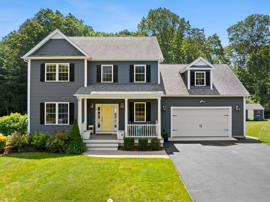 a front view of a house with yard