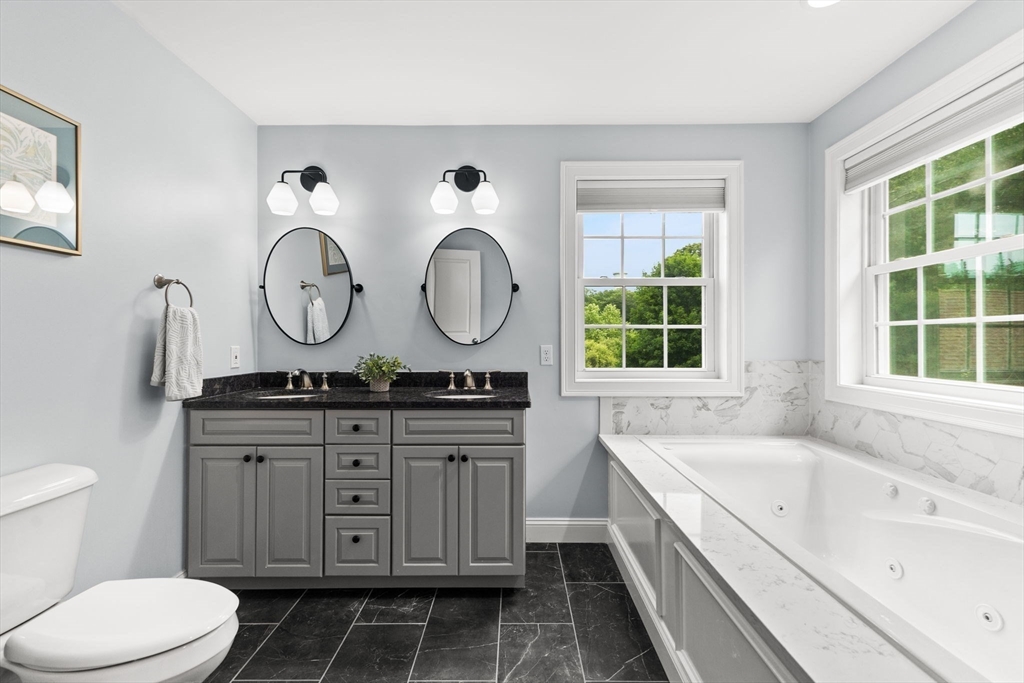6 Jacoby Way Seekonk, MA 02771 - Photo 21 of 42 a bathroom with a granite countertop sink mirror vanity and a toilet