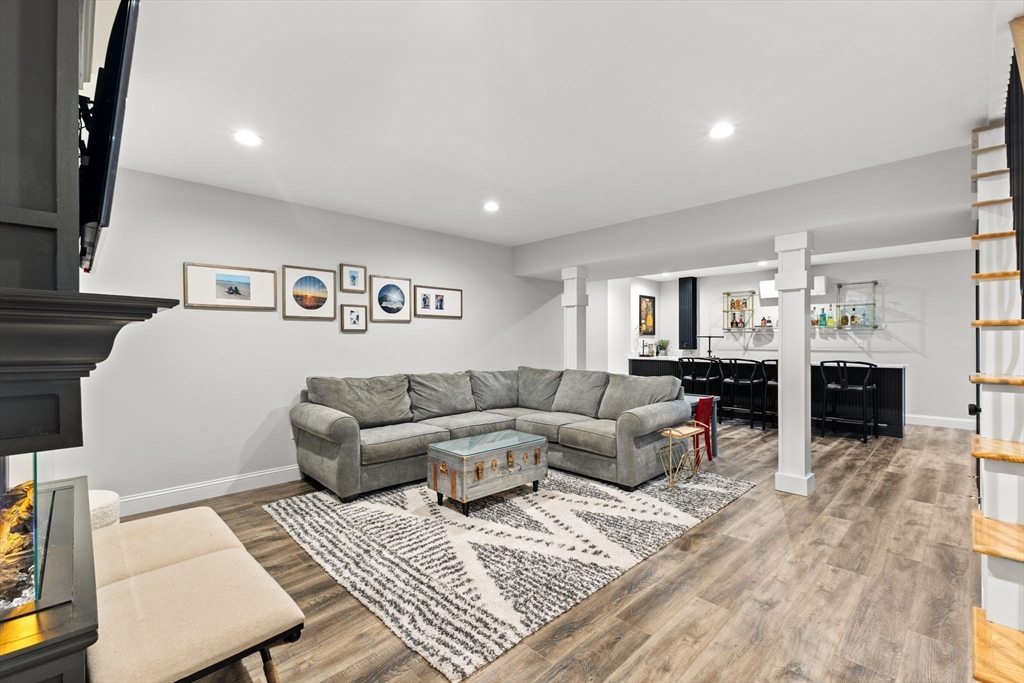 6 Jacoby Way Seekonk, MA 02771 - Photo 32 of 42 a living room with furniture and a flat screen tv