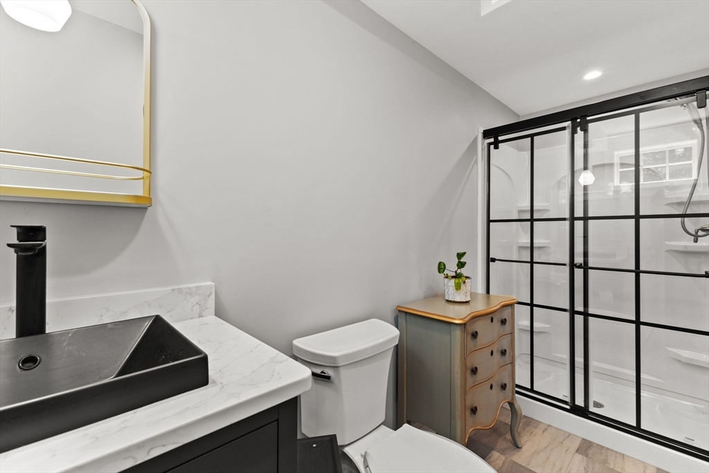 6 Jacoby Way Seekonk, MA 02771 - Photo 36 of 42 a bathroom with a toilet a sink and a window