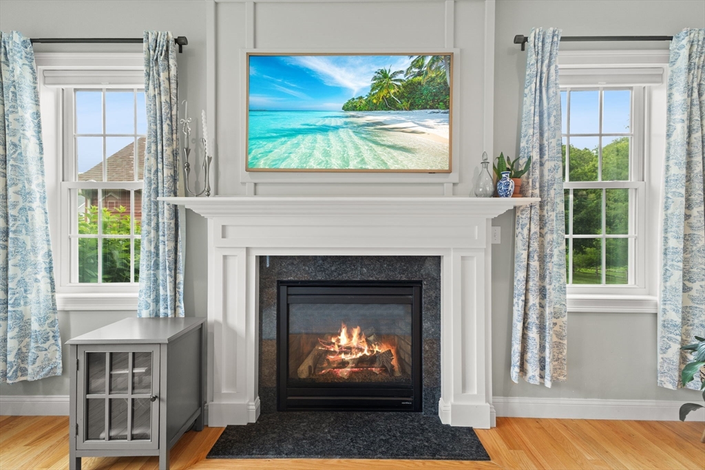 6 Jacoby Way Seekonk, MA 02771 - Photo 8 of 42 a living room with a fireplace and a window