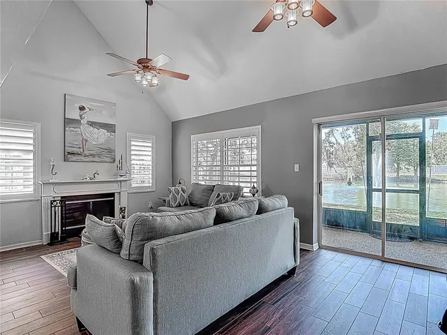 a kitchen with granite countertop a stove and wooden floor