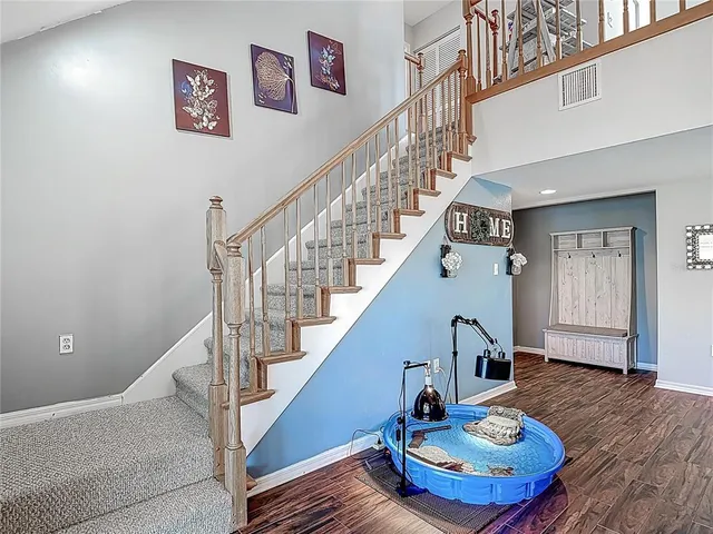 a kitchen with stainless steel appliances granite countertop a stove and a refrigerator