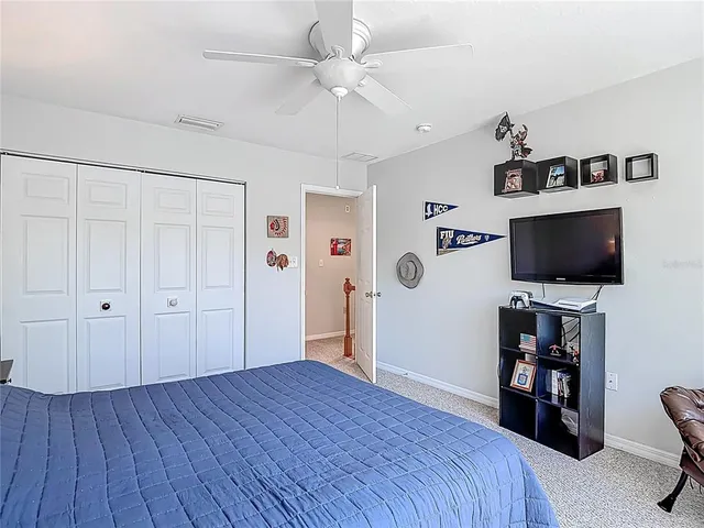 a view of a lake with houses in the back