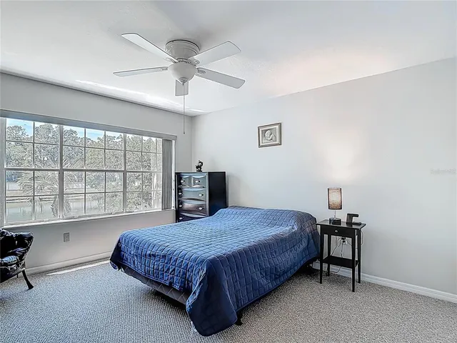 a view of a house with backyard and porch