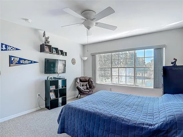 a front view of a house with a garden and yard