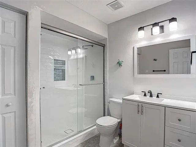 a aerial view of a house with a yard