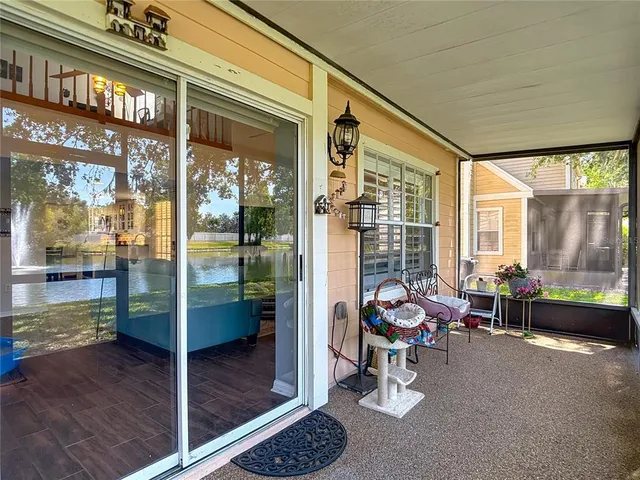 an aerial view of residential house with outdoor space and lake view